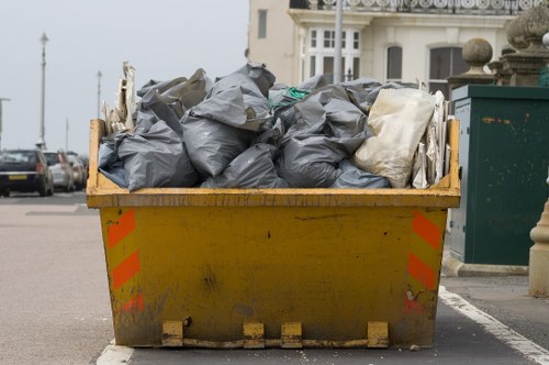 Professionals clearing clutter from a garage in Dalston